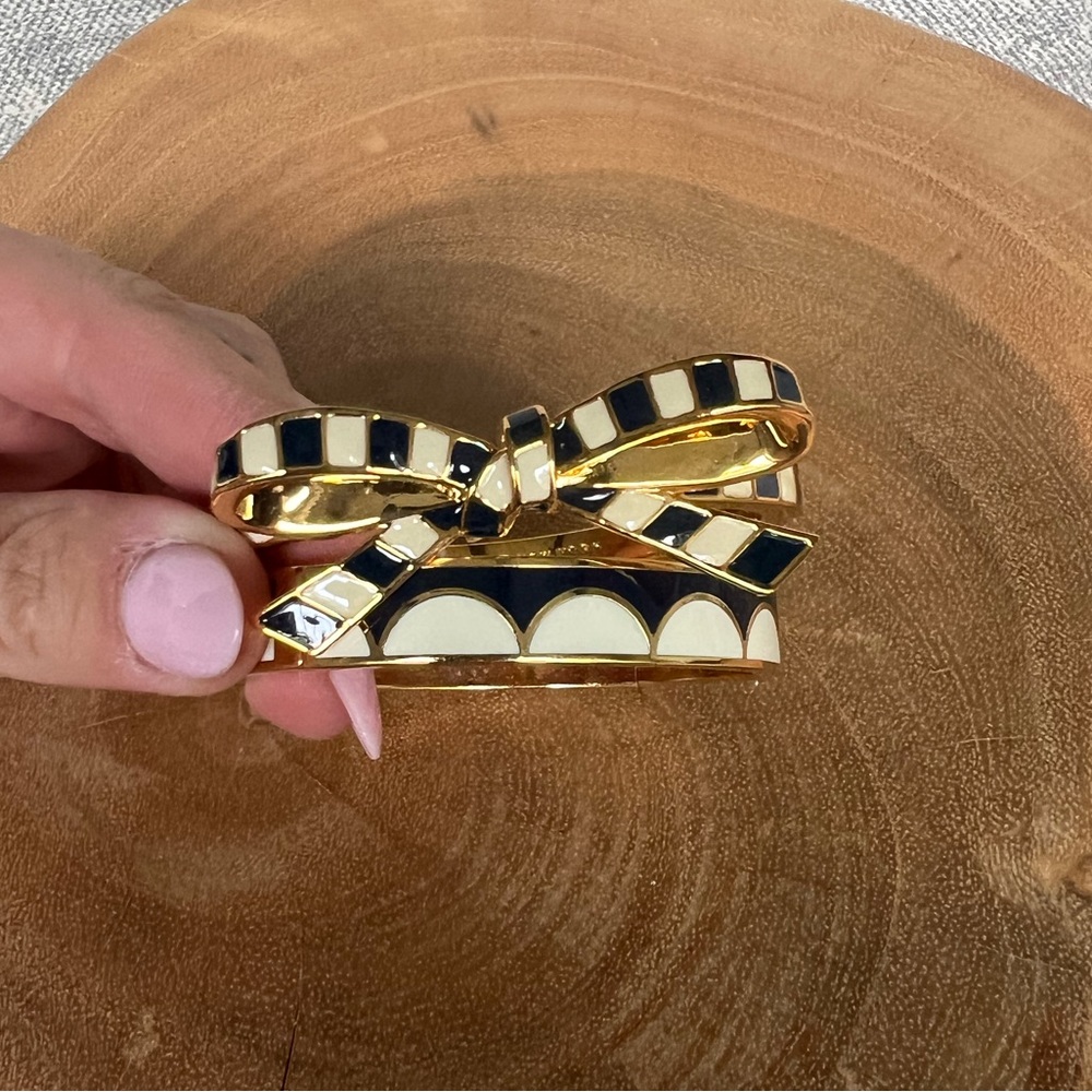 Pair of Kate Spade Navy, Gold, and Cream Bangles
